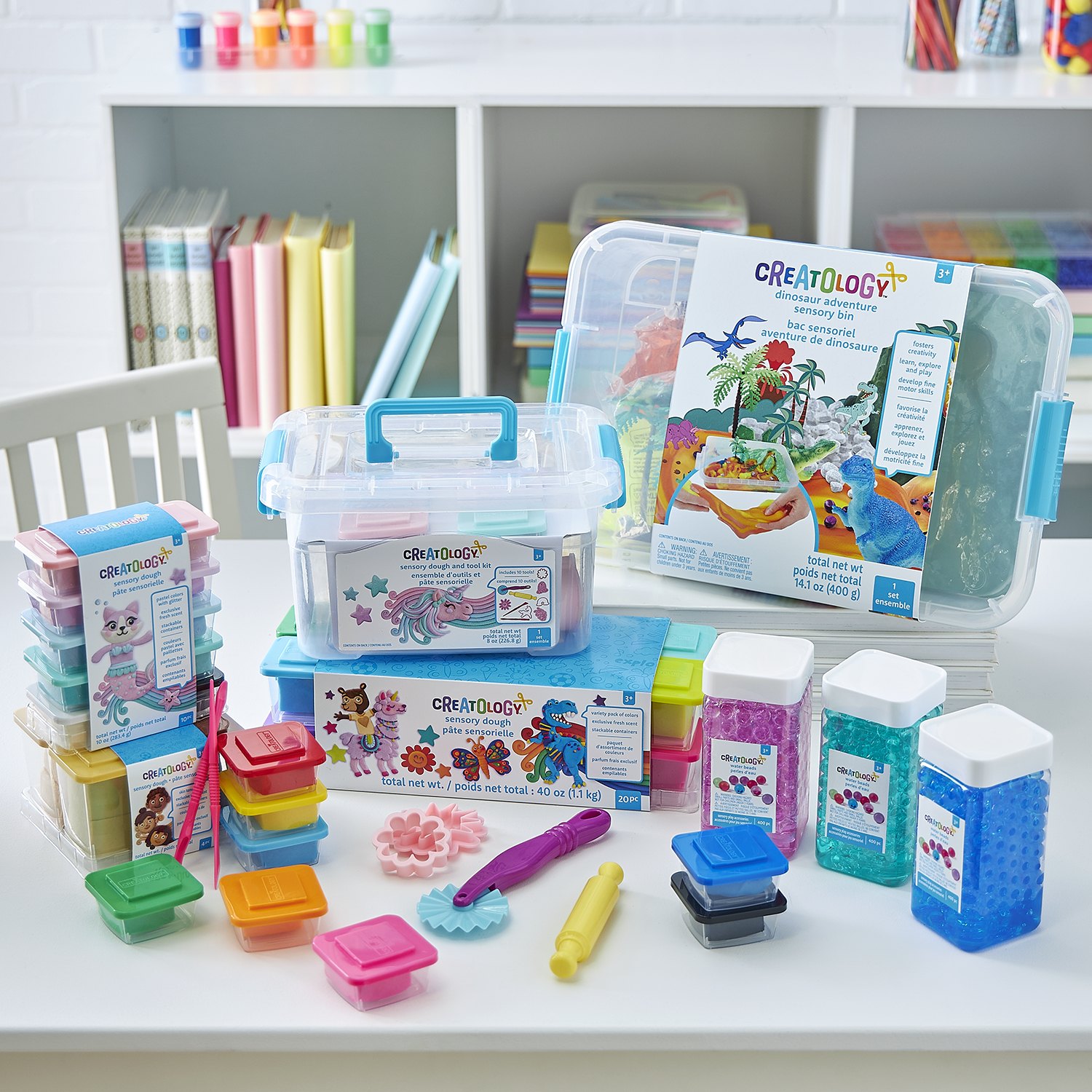 Creatology craft boxes stacked on a storage shelf